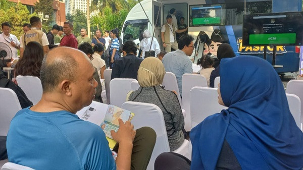 Mata Pengunjung CFD Jalan Sudirman Tertuju Booth Pasporia Imigrasi Jaktim. Ada Apa Ya?